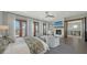 Spacious main bedroom with fireplace, balcony access, and elegant design elements at 795 Marbury Ln, Longboat Key, FL 34228