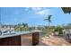 Outdoor kitchen is equipped with a sink, refrigerator, and counter space for outdoor dining and entertainment at 795 Marbury Ln, Longboat Key, FL 34228