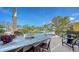 Outdoor entertaining area with marble countertop and outdoor seating at 795 Marbury Ln, Longboat Key, FL 34228