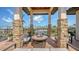 Comfortable outdoor seating surrounds a stylish fire pit, perfect for relaxation and enjoying scenic views at 795 Marbury Ln, Longboat Key, FL 34228