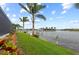 A grassy backyard leading to a private dock and the canal at 8106 Arlewood Cir, Port Charlotte, FL 33981