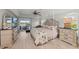 Spacious bedroom with king bed, ceiling fan, and access to the lanai at 8106 Arlewood Cir, Port Charlotte, FL 33981