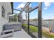Covered hot tub on a lanai overlooking the canal and dock at 8106 Arlewood Cir, Port Charlotte, FL 33981