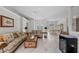 Spacious living room is brightly lit with marble floors, large windows and elegant seating at 8106 Arlewood Cir, Port Charlotte, FL 33981