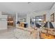 This airy living space is open to the kitchen and features marble flooring and great backyard views at 8106 Arlewood Cir, Port Charlotte, FL 33981