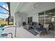 Relaxing screened patio with comfortable seating options near the pool area at 8106 Arlewood Cir, Port Charlotte, FL 33981