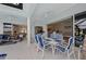Inviting outdoor patio with dining set, comfortable seating, and view of the home's interior at 8106 Arlewood Cir, Port Charlotte, FL 33981