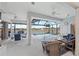 Screened pool area with dining and seating areas, offering a relaxing outdoor experience at 8106 Arlewood Cir, Port Charlotte, FL 33981