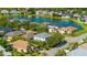Aerial view showcasing the property's location in a neighborhood surrounded by lake views at 8804 Founders Cir, Palmetto, FL 34221