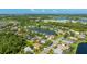 Expansive aerial view of the home set among numerous lake-filled neighborhoods and lush Florida trees at 8804 Founders Cir, Palmetto, FL 34221