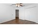 Bedroom with wood floors, a ceiling fan, and a closet at 8804 Founders Cir, Palmetto, FL 34221