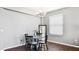 Cozy dining room features a round table, chandelier, and window with natural light at 8804 Founders Cir, Palmetto, FL 34221
