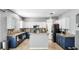 Spacious kitchen with white and blue cabinetry, stainless steel appliances, and stylish granite countertops at 8804 Founders Cir, Palmetto, FL 34221