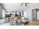 Bright living room view showcases open layout, flowing into the kitchen and stairs to a second floor at 8804 Founders Cir, Palmetto, FL 34221
