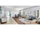 Inviting living room with hardwood floors, neutral decor, and ample natural light at 8804 Founders Cir, Palmetto, FL 34221