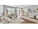 Well-lit living room with stylish decor, comfortable seating, and an open floor plan at 8804 Founders Cir, Palmetto, FL 34221