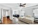 Spacious main bedroom with tray ceiling, sitting area, walk in closet, and ensuite bath at 8804 Founders Cir, Palmetto, FL 34221