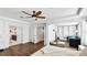 Open-concept main bedroom featuring wood floors and an ensuite bathroom with a walk-in closet at 8804 Founders Cir, Palmetto, FL 34221