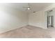Spacious carpeted bedroom featuring a ceiling fan and access to an attached bathroom at 8820 Heritage Sound Dr, Bradenton, FL 34212
