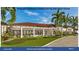 Proposed clubhouse outdoor dining with doors closed and lush tropical landscaping at 8820 Heritage Sound Dr, Bradenton, FL 34212