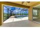Stunning screened-in pool area with lush landscaping and serene water views at 8820 Heritage Sound Dr, Bradenton, FL 34212