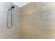 Walk-in shower featuring neutral tile and showerhead at 8820 Heritage Sound Dr, Bradenton, FL 34212