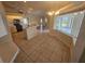 Well-lit kitchen with adjacent dining space, modern appliances, and open layout to living areas at 9926 Gulfstream Blvd, Englewood, FL 34224
