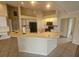 Bright kitchen featuring a large island, modern appliances, and ample cabinet space at 9926 Gulfstream Blvd, Englewood, FL 34224