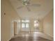 Spacious living room with high ceilings and abundant natural light, creating a welcoming atmosphere at 9926 Gulfstream Blvd, Englewood, FL 34224