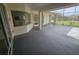 Extended patio featuring a covered area, offering a versatile space for outdoor gatherings and relaxing at 9926 Gulfstream Blvd, Englewood, FL 34224