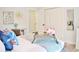 A bedroom with desk and chair, wood floors, a bed, a decorative clock, and a large mirror at 1112 Montezuma Dr, Bradenton, FL 34209