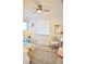 A bedroom with bunk beds, wood floors, decor, artwork, and a window at 1112 Montezuma Dr, Bradenton, FL 34209