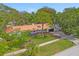 Stunning single story home with a metal roof and lush landscaping at 1112 Montezuma Dr, Bradenton, FL 34209