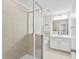 Modern bathroom with walk-in shower, tiled walls, and a bright, clean aesthetic at 11434 Spring Gate Trl, Bradenton, FL 34211