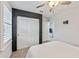 Bedroom with large closet, ceiling fan, and sleek, modern design at 11434 Spring Gate Trl, Bradenton, FL 34211