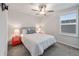 Bedroom features a modern bed, window with shutters, and brightly colored bedside tables at 11434 Spring Gate Trl, Bradenton, FL 34211