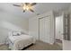 Bedroom featuring carpet, a ceiling fan, and a closet with bifold doors at 11434 Spring Gate Trl, Bradenton, FL 34211