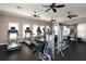 Well-equipped gym with treadmills, weight machines, ceiling fans, and natural light at 11434 Spring Gate Trl, Bradenton, FL 34211