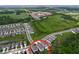 Neighborhood aerial view featuring lush green spaces, a lake, and single-Gathering homes at 12832 Oak Hill Way, Parrish, FL 34219