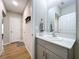 Modern bathroom with white quartz countertops, gray cabinets, and stylish fixtures at 12832 Oak Hill Way, Parrish, FL 34219