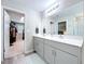 Modern bathroom featuring double sinks, quartz countertops, and neutral color scheme at 12832 Oak Hill Way, Parrish, FL 34219