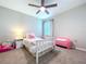 Comfortable bedroom with a rainbow theme, ceiling fan, and plenty of natural light at 12832 Oak Hill Way, Parrish, FL 34219