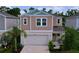 Charming home featuring a two-car garage, a small porch, and well-manicured landscaping at 12832 Oak Hill Way, Parrish, FL 34219