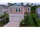 Two-story home featuring a two-car garage, modern design, and well-maintained landscaping at 12832 Oak Hill Way, Parrish, FL 34219