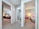 Hallway with views into a bedroom, full bathroom and a bedroom at 12832 Oak Hill Way, Parrish, FL 34219