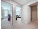 Hallway view showcasing carpet, bedroom and living room featuring neutral walls and connecting spaces at 12832 Oak Hill Way, Parrish, FL 34219
