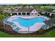 Community pool includes ample lounge chairs, a covered area, and a unique shape at 12832 Oak Hill Way, Parrish, FL 34219