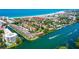 Stunning aerial shot of condo community with boat docks and beach access on the Gulf Coast at 1300 N Portofino Dr # 103, Sarasota, FL 34242