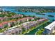 Scenic aerial of waterfront condos with boat access, landscaping and views of the Gulf at 1300 N Portofino Dr # 103, Sarasota, FL 34242
