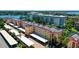 An aerial view shows the property's well-maintained landscaping and proximity to water at 1300 N Portofino Dr # 103, Sarasota, FL 34242